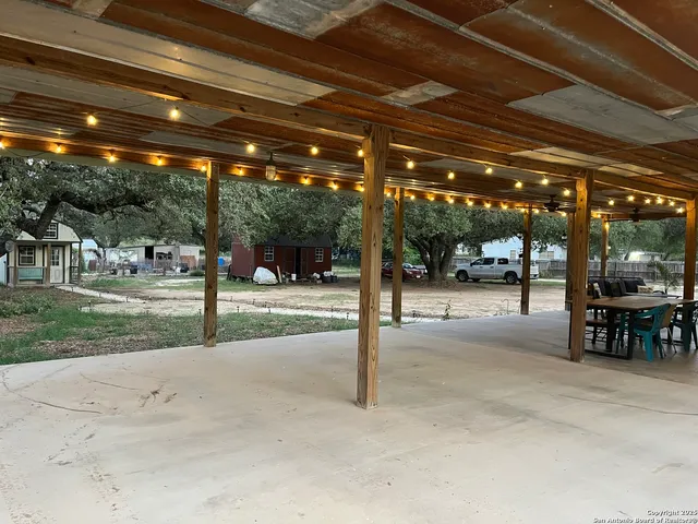 a view of a yard with trees