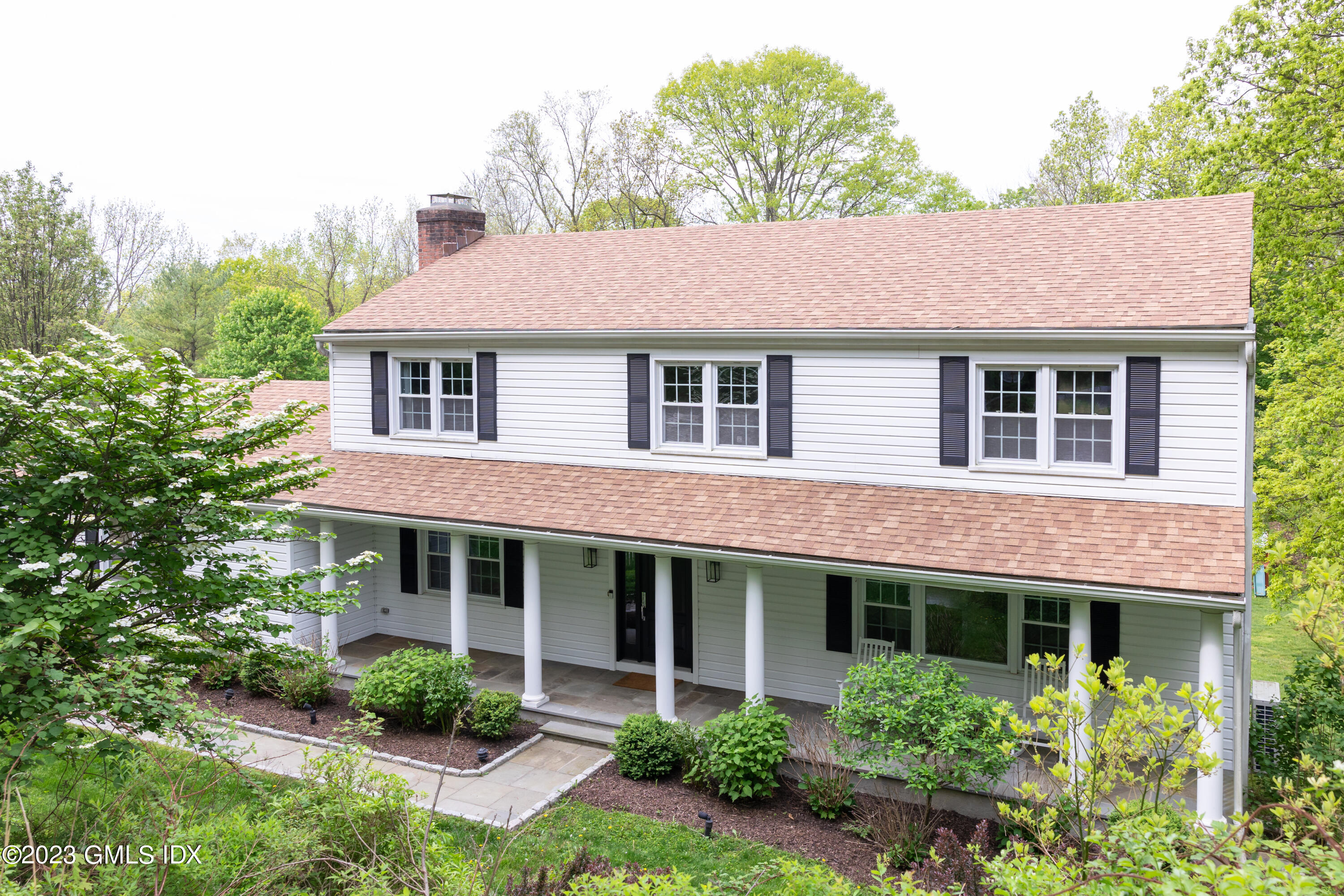 340 Webbs Hill Road Stamford, CT 06903 - Photo 1 of 36 a front view of a house with a yard