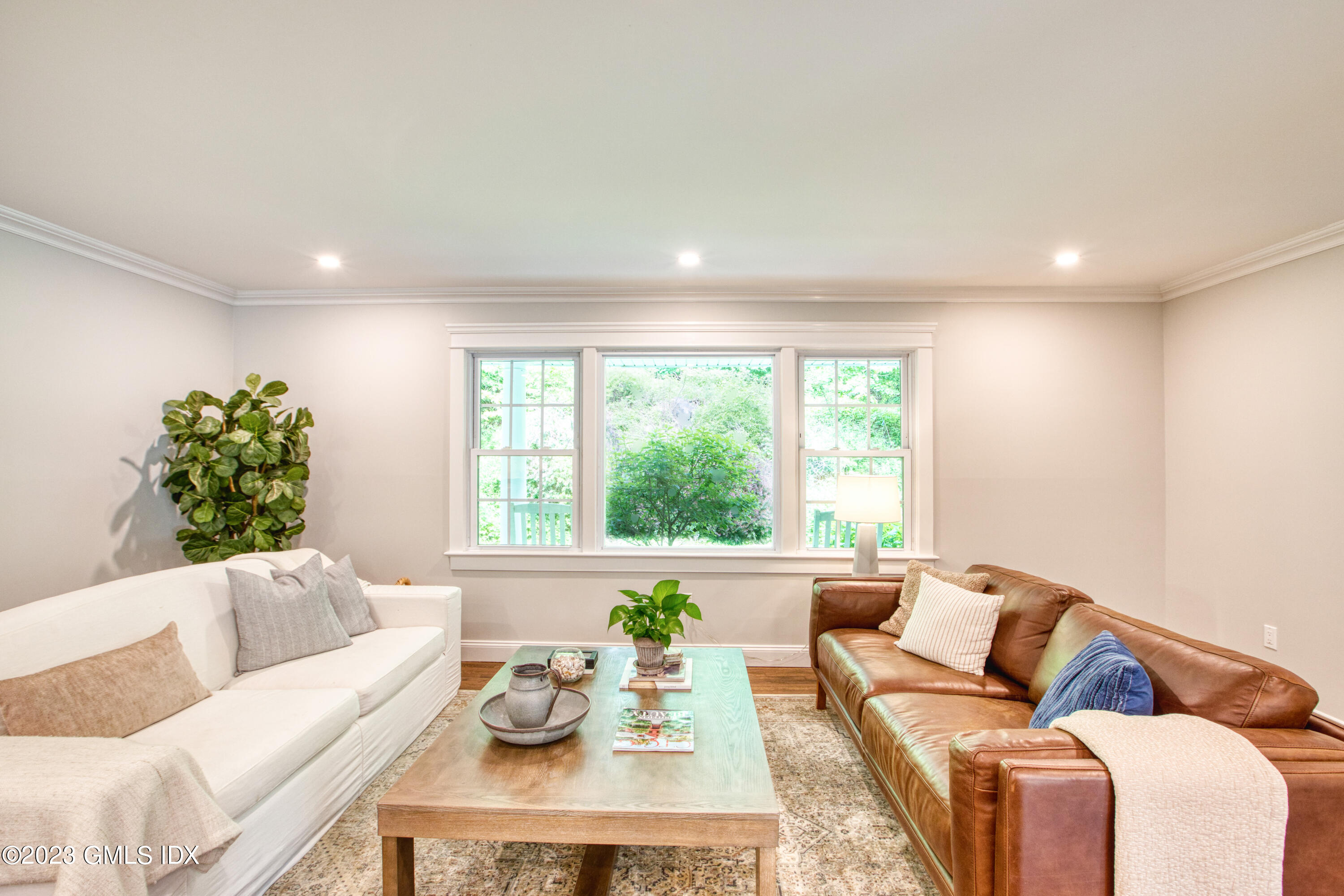 340 Webbs Hill Road Stamford, CT 06903 - Photo 13 of 36 a living room with furniture and flowers