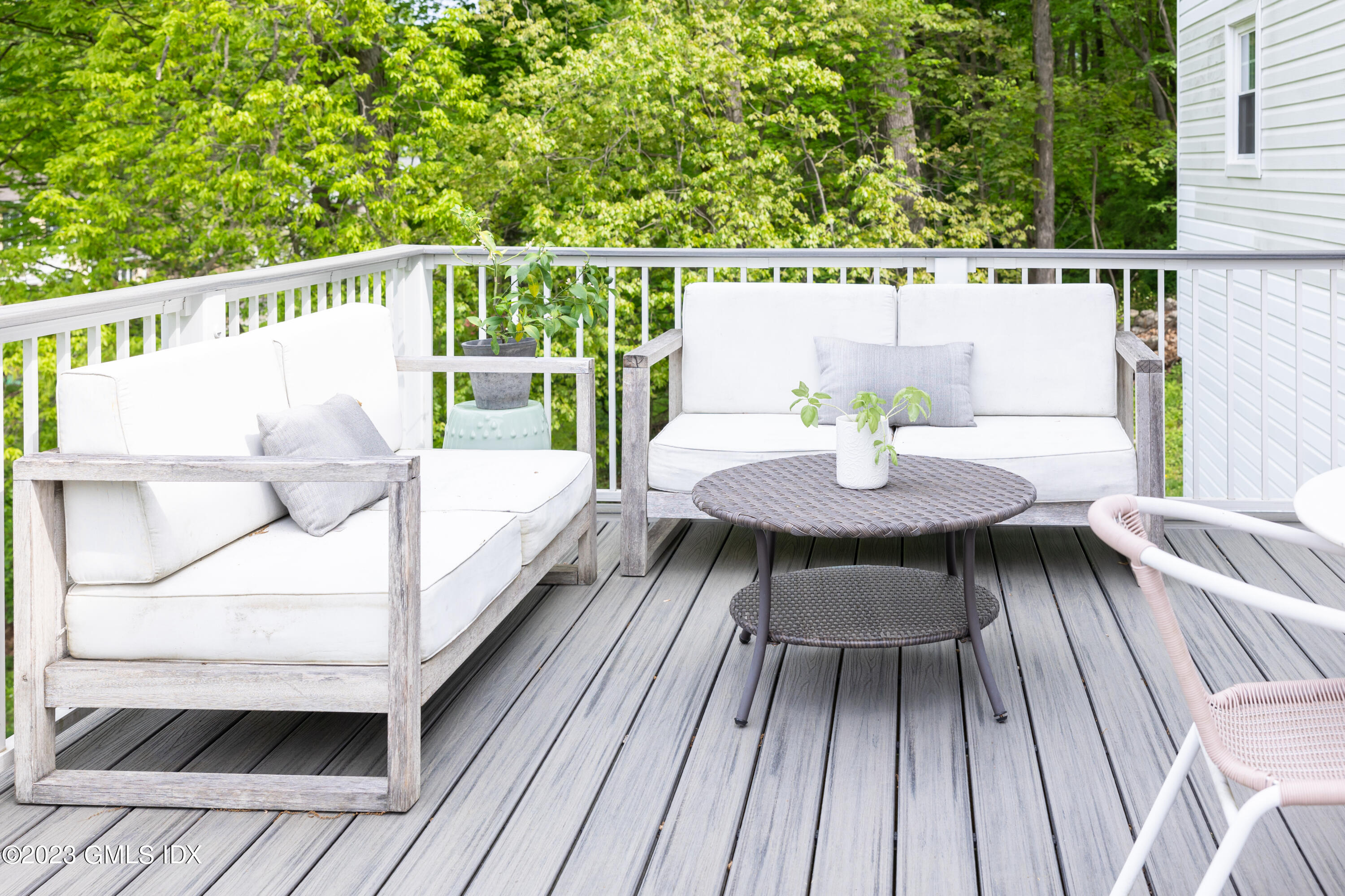 340 Webbs Hill Road Stamford, CT 06903 - Photo 16 of 36 a balcony with wooden floor table and chairs