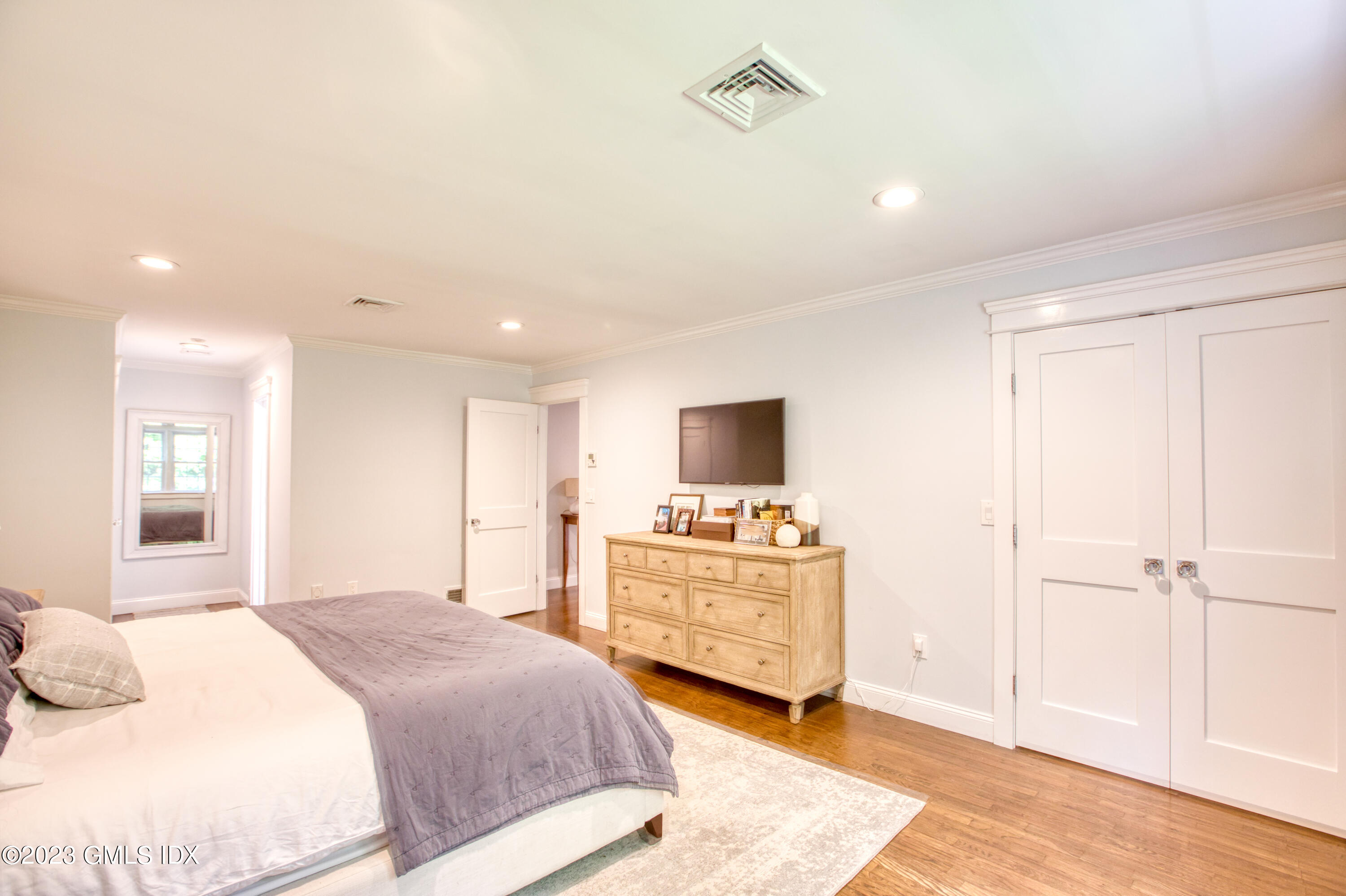 340 Webbs Hill Road Stamford, CT 06903 - Photo 20 of 36 a bedroom with a bed and a flat screen tv