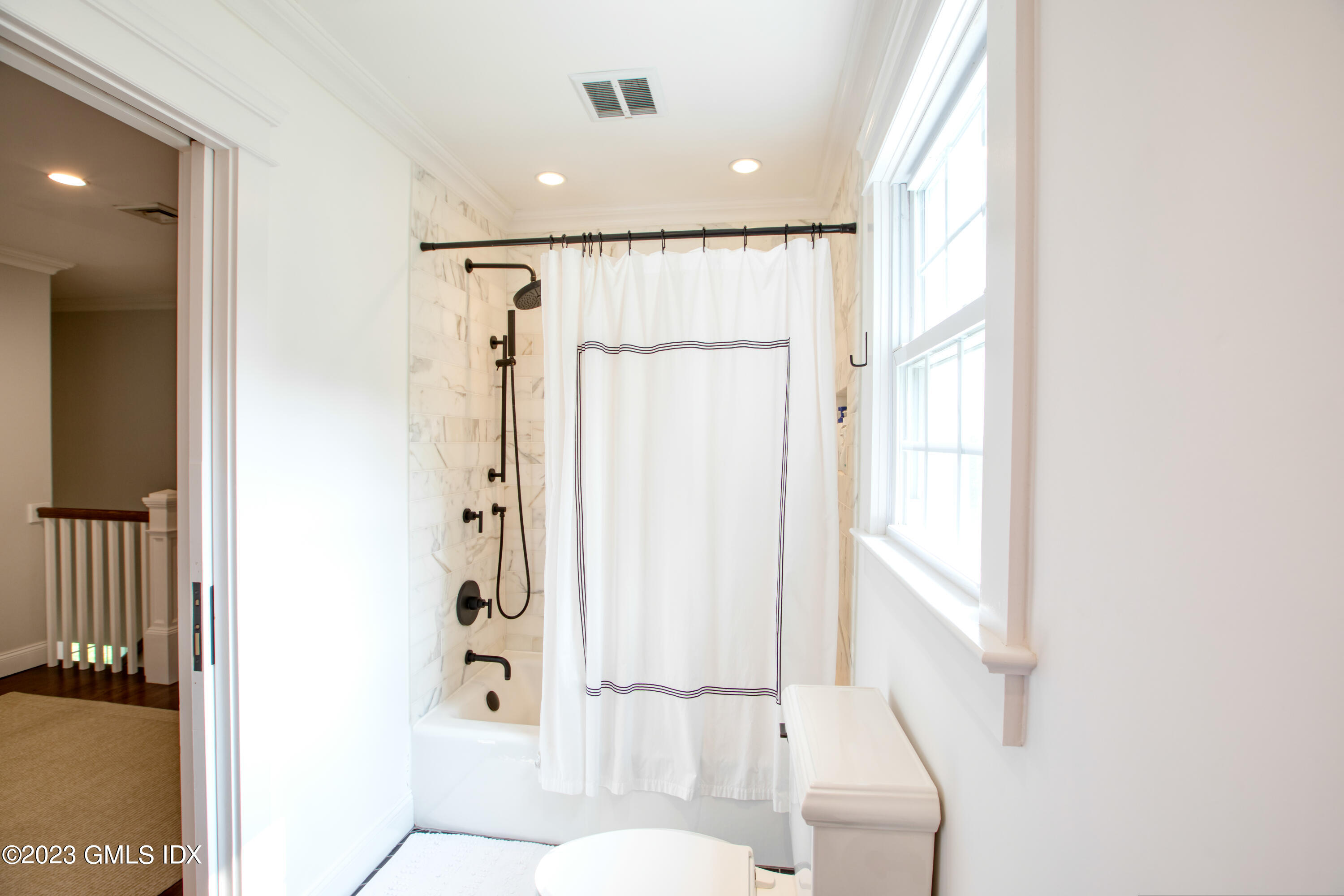 340 Webbs Hill Road Stamford, CT 06903 - Photo 29 of 36 a bathroom with a shower and a tub