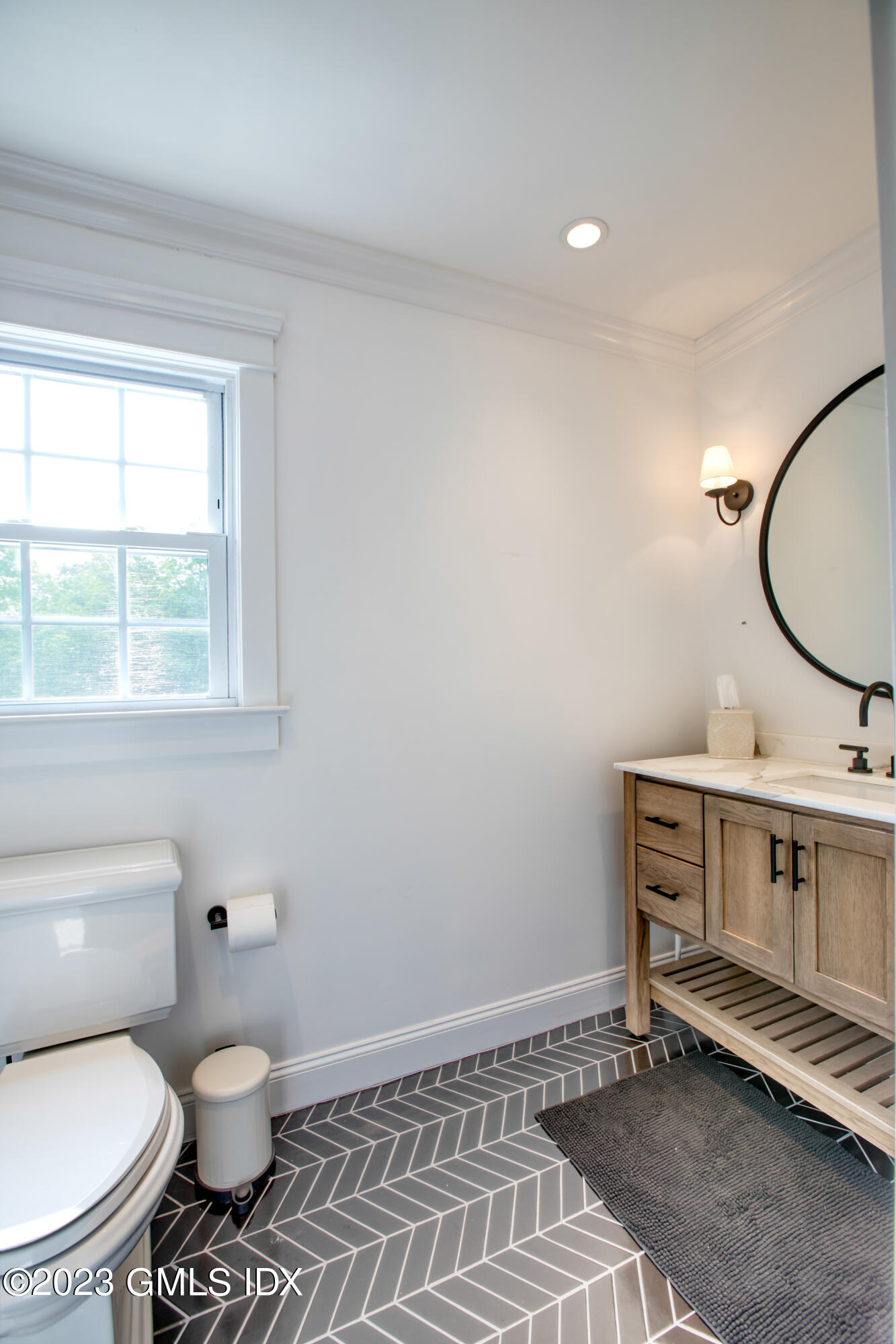 340 Webbs Hill Road Stamford, CT 06903 - Photo 30 of 36 a bathroom with a toilet a sink and a window