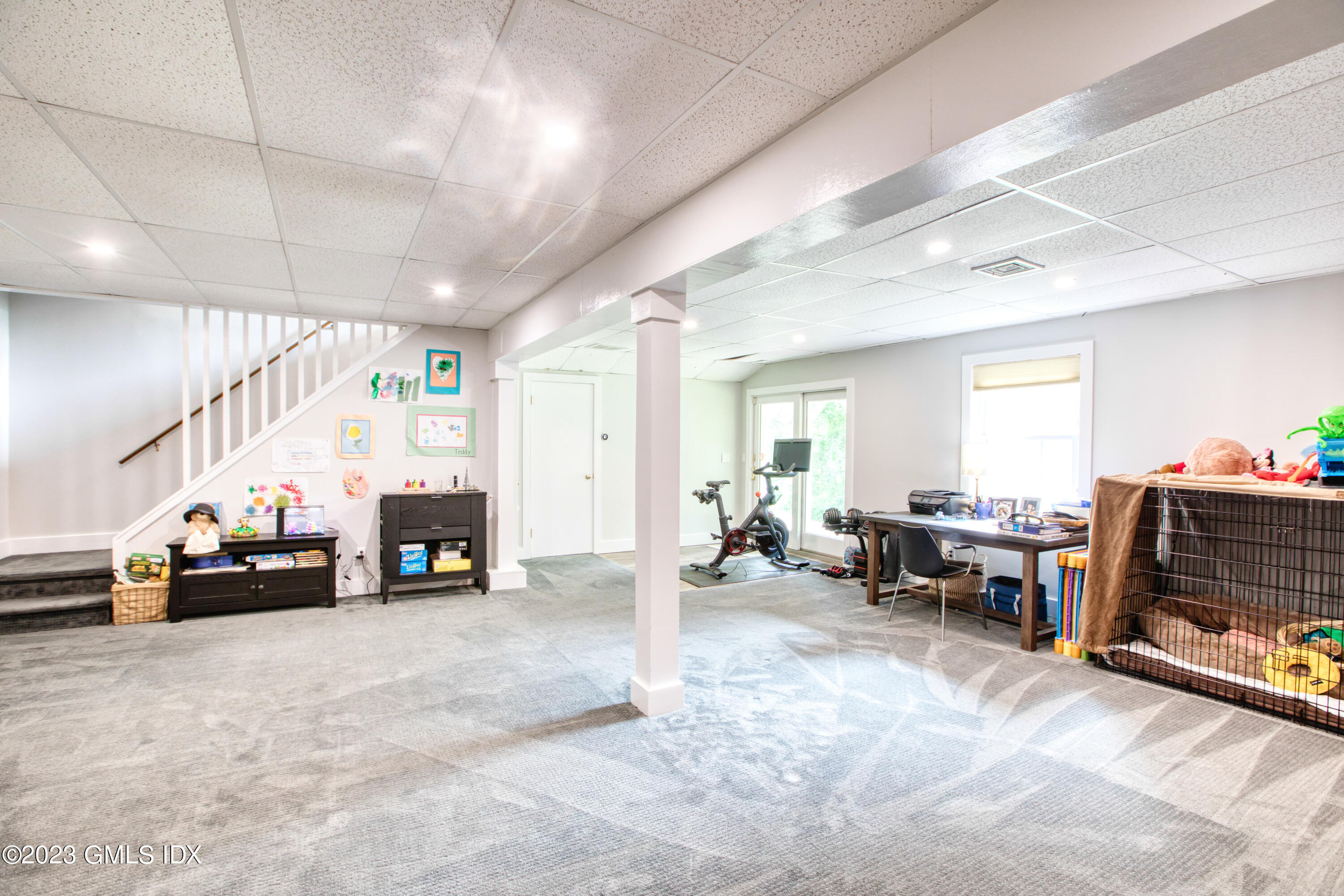 340 Webbs Hill Road Stamford, CT 06903 - Photo 31 of 36 a garage with furniture and a flat screen tv