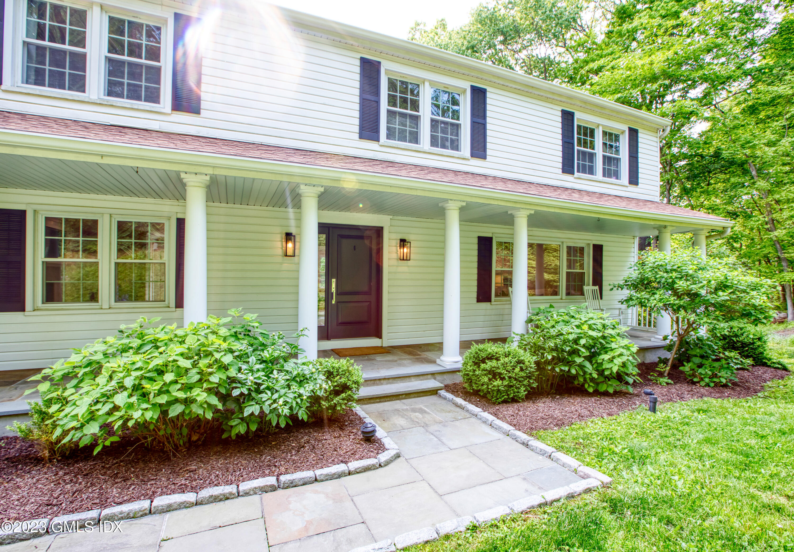 340 Webbs Hill Road Stamford, CT 06903 - Photo 5 of 36 a front view of a house with garden