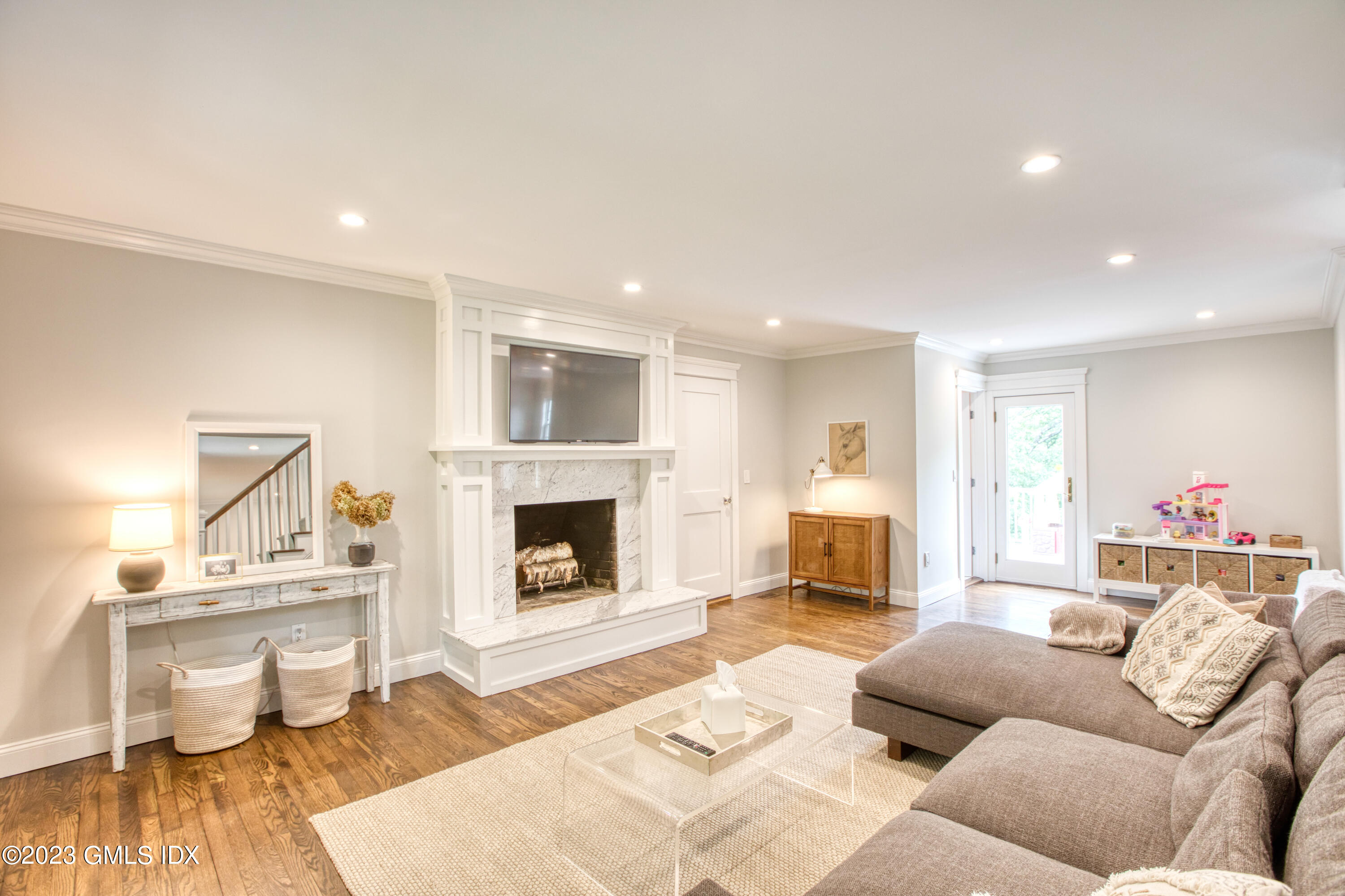 340 Webbs Hill Road Stamford, CT 06903 - Photo 6 of 36 a living room with furniture and a fireplace