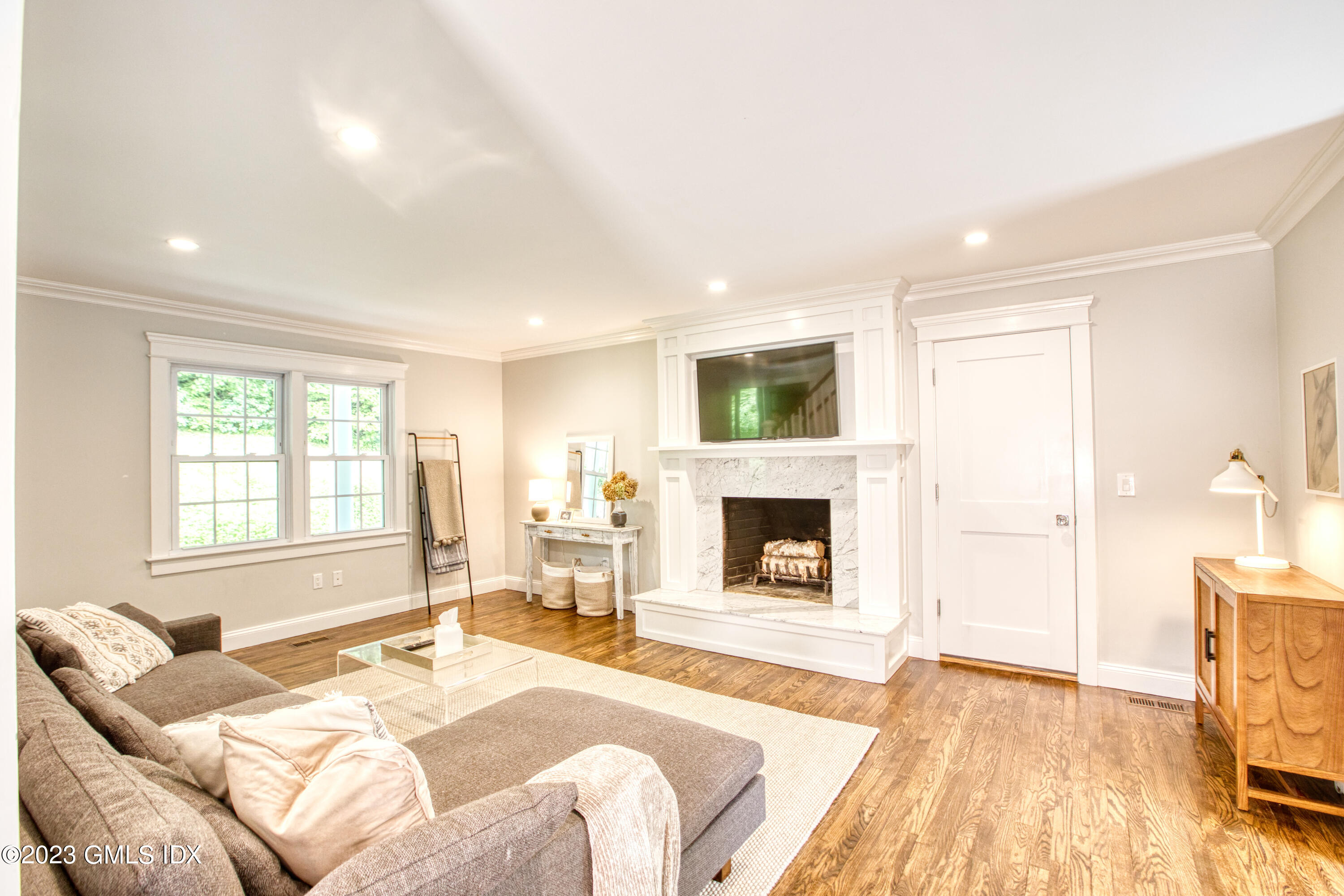 340 Webbs Hill Road Stamford, CT 06903 - Photo 7 of 36 a spacious bedroom with a bed and wooden floor