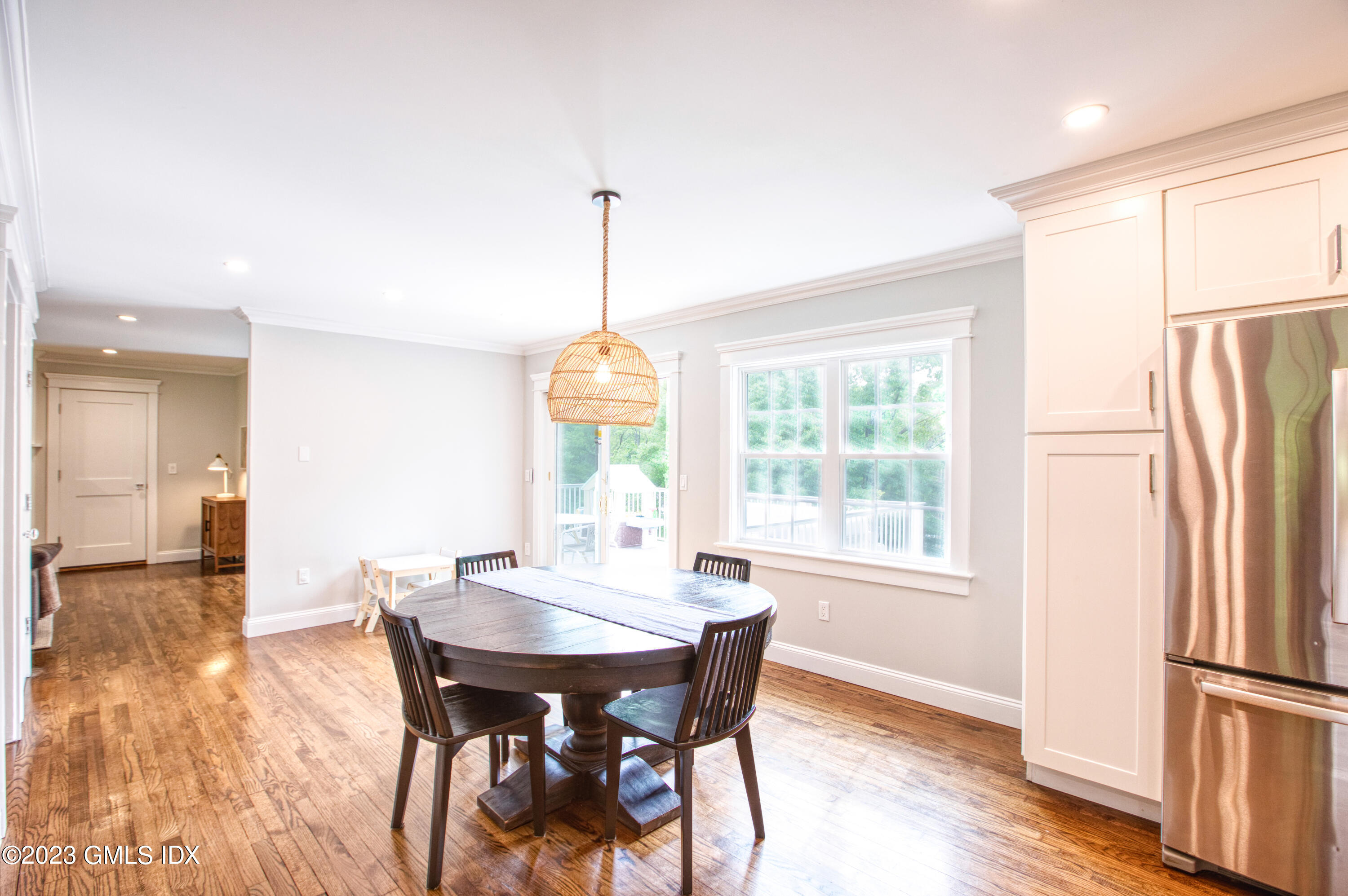 340 Webbs Hill Road Stamford, CT 06903 - Photo 9 of 36 a view of a dining room with furniture window and wooden floor