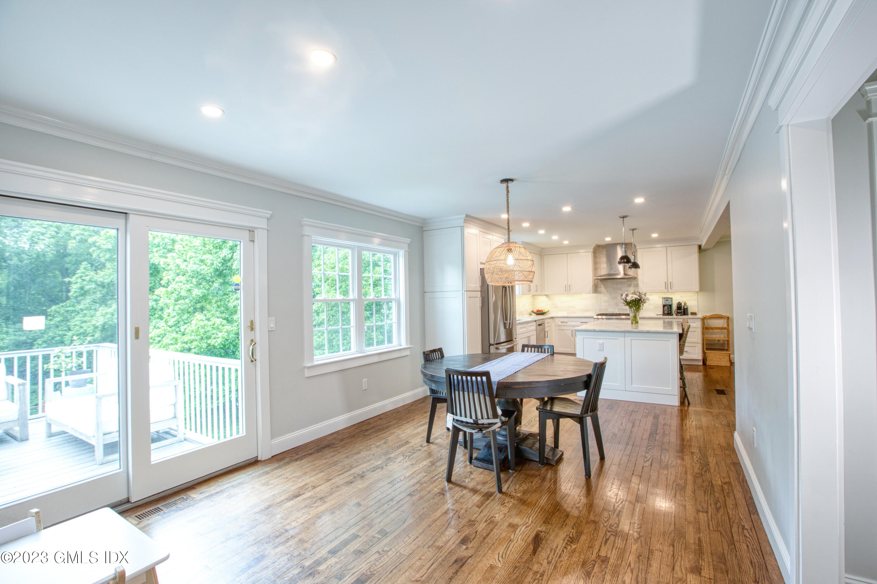 340 Webbs Hill Road Stamford, CT 06903 - Photo 10 of 36 a view of a dining room with furniture and wooden floor