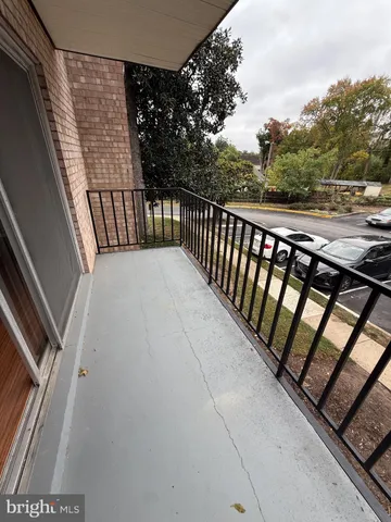 a view of balcony with wooden floor