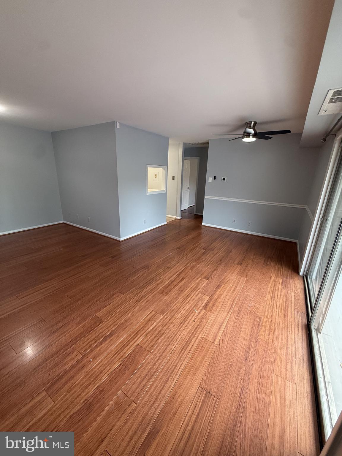 12650 Dara Drive, Unit 204 Woodbridge, VA 22192 - Photo 3 of 12 wooden floor in an empty room with a window