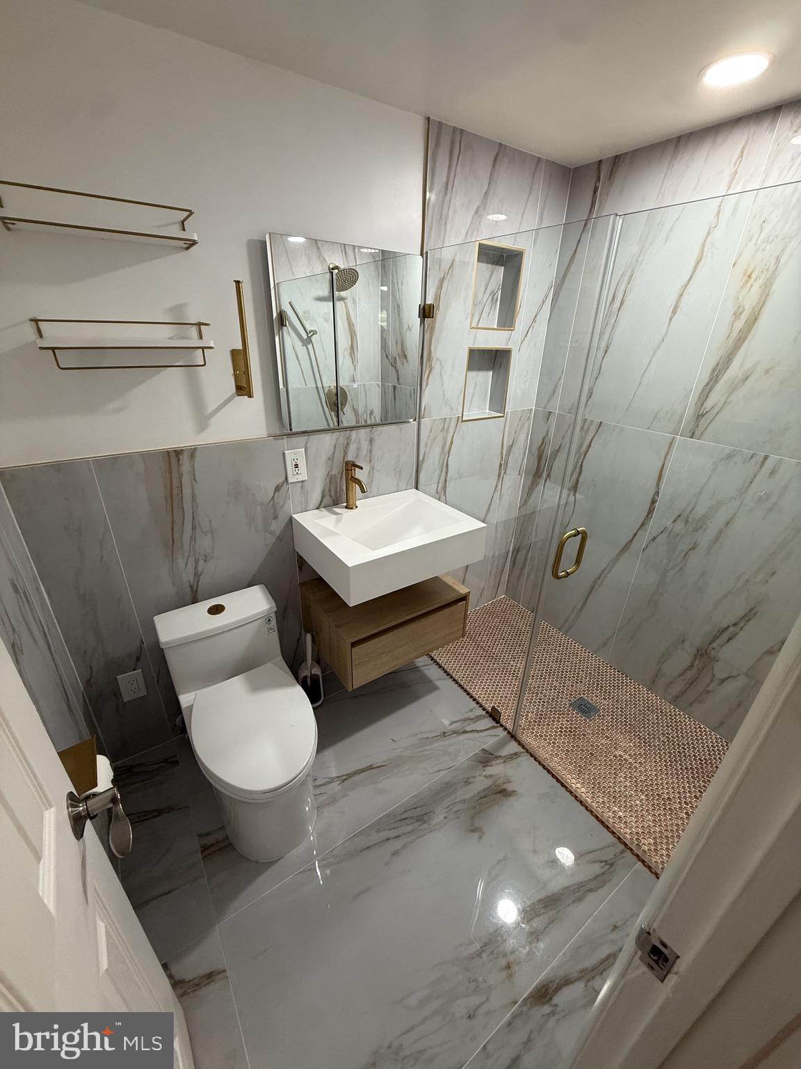 12650 Dara Drive, Unit 204 Woodbridge, VA 22192 - Photo 8 of 12 a bathroom with a sink toilet and shower