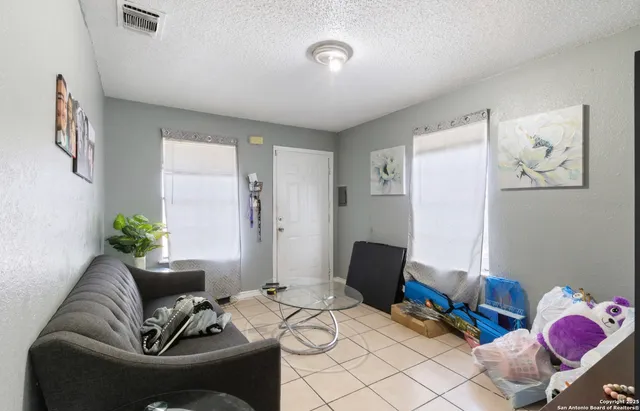 a livingroom with window and couch