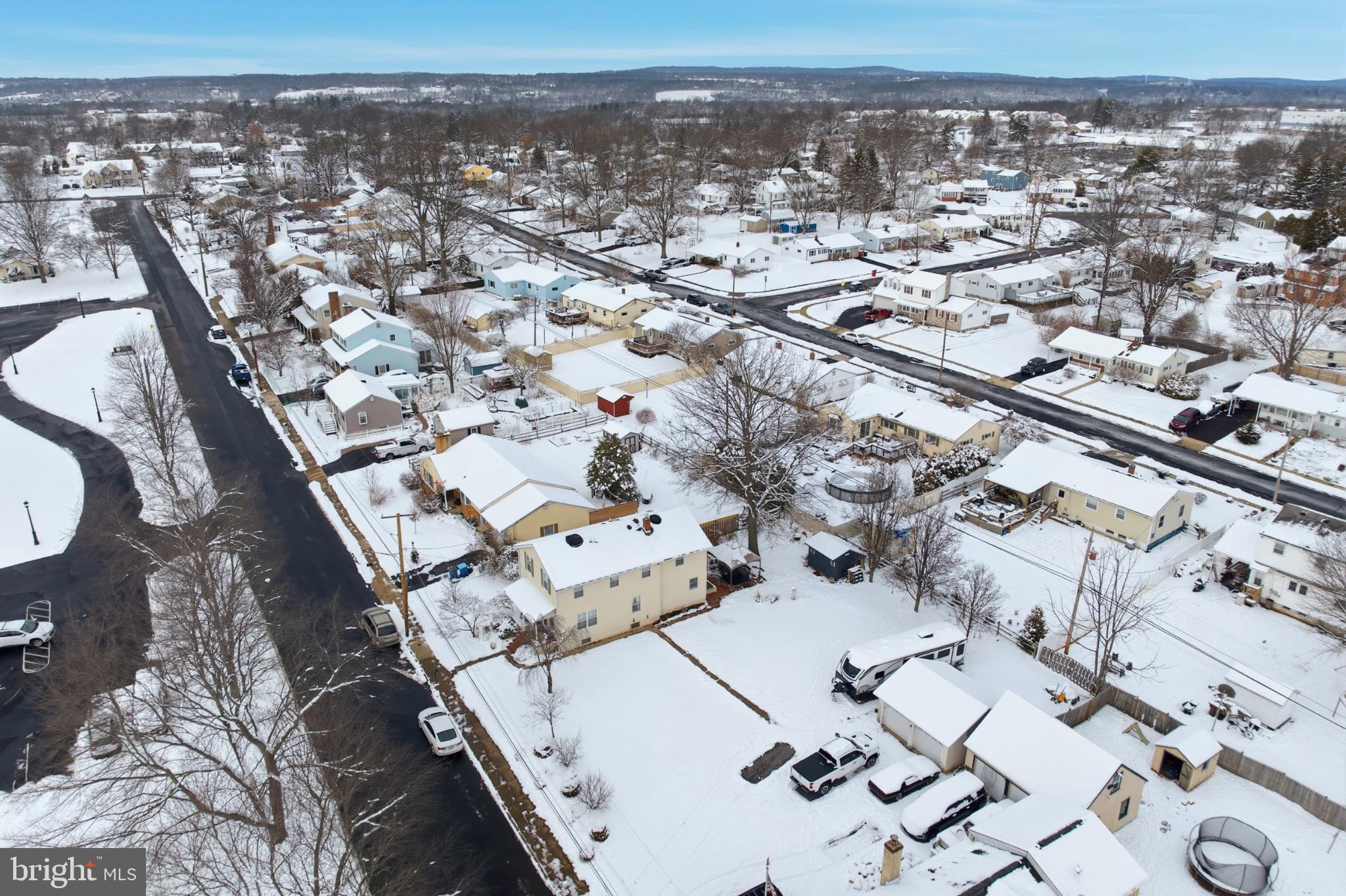 301 North 3rd Street Telford, PA 18969 - Photo 37 of 47 Snow-covered neighborhood under a clear sky.