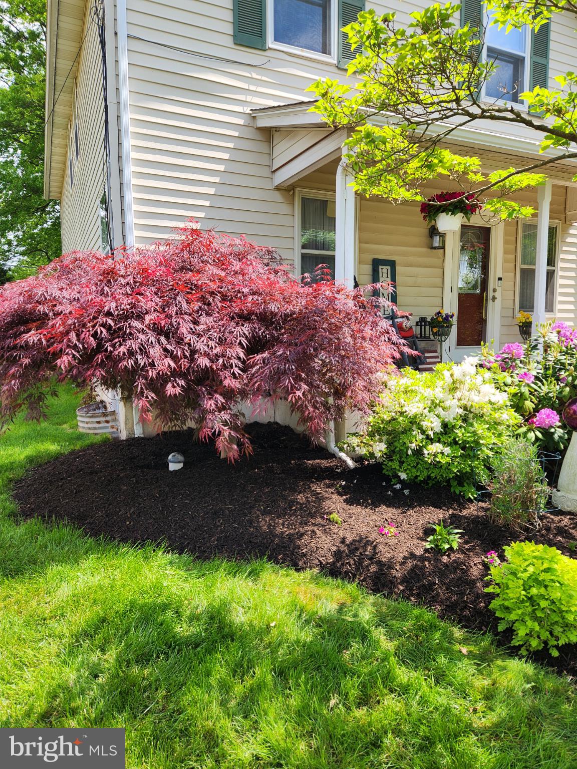 301 North 3rd Street Telford, PA 18969 - Photo 42 of 47 Lush garden blooms by a charming entrance.