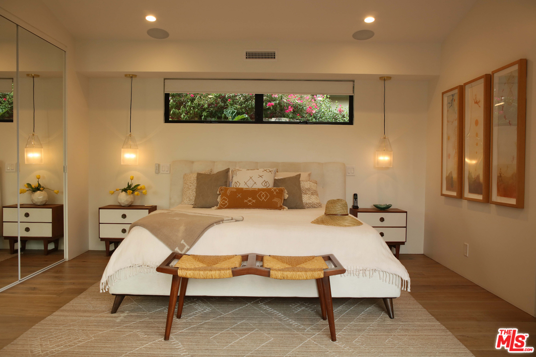 2652 Byron Place Los Angeles, CA 90046 - Photo 11 of 15 a spacious bedroom with a bed and lamp