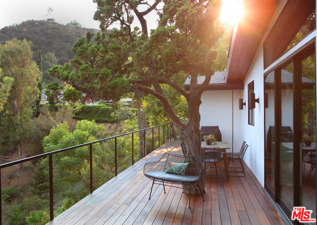 2652 Byron Place Los Angeles, CA 90046 - Photo 13 of 15 a view of a balcony with chairs and wooden floor