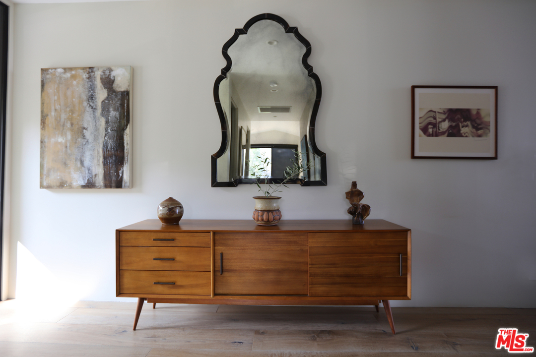 2652 Byron Place Los Angeles, CA 90046 - Photo 3 of 15 a room with painting on the wall and a dresser