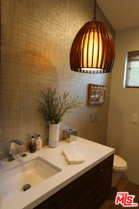 2652 Byron Place Los Angeles, CA 90046 - Photo 10 of 15 a bathroom with a sink a mirror and a toilet