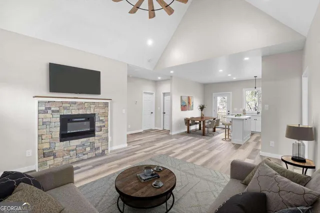 a living room with furniture and a fireplace