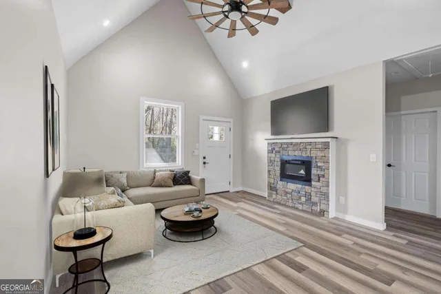 a living room with furniture and a fireplace