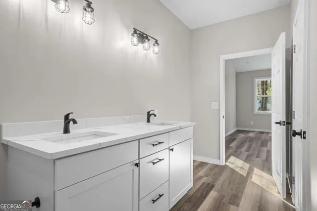 a en suite bathroom with a sink and mirror