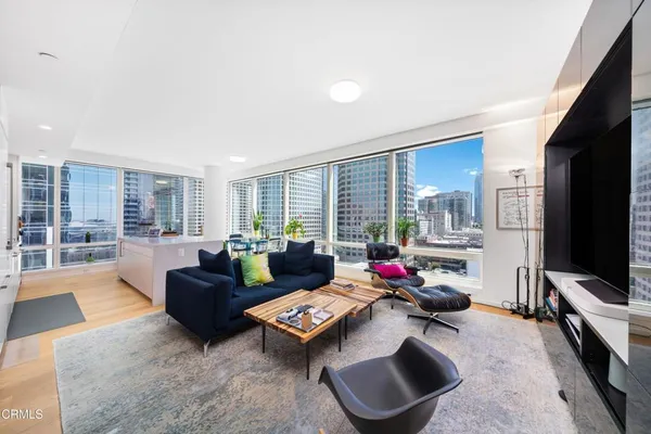 a living room with furniture and a flat screen tv