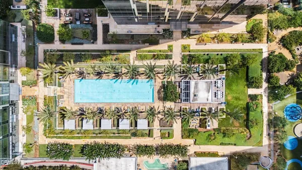 a view of swimming pool with outdoor seating