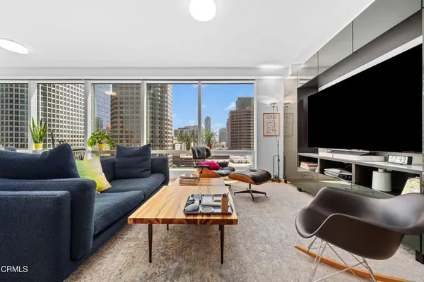 a living room with furniture and a flat screen tv