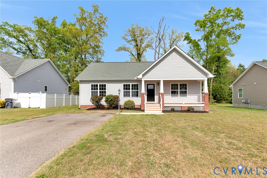 9925 Reymet Court Richmond, VA 23237 - Photo 3 of 30 a front view of a house with a garden and porch