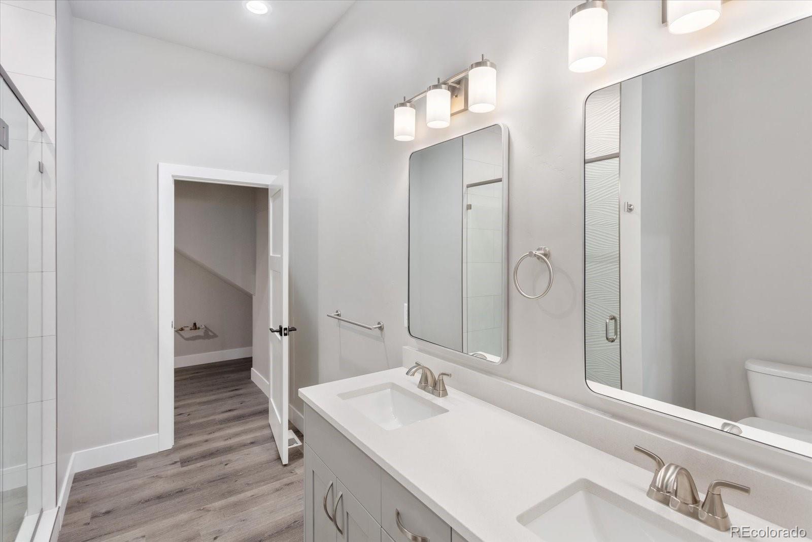 128 Southside Loop Salida, CO 81201 - Photo 11 of 20 a bathroom with a sink vanity and mirror