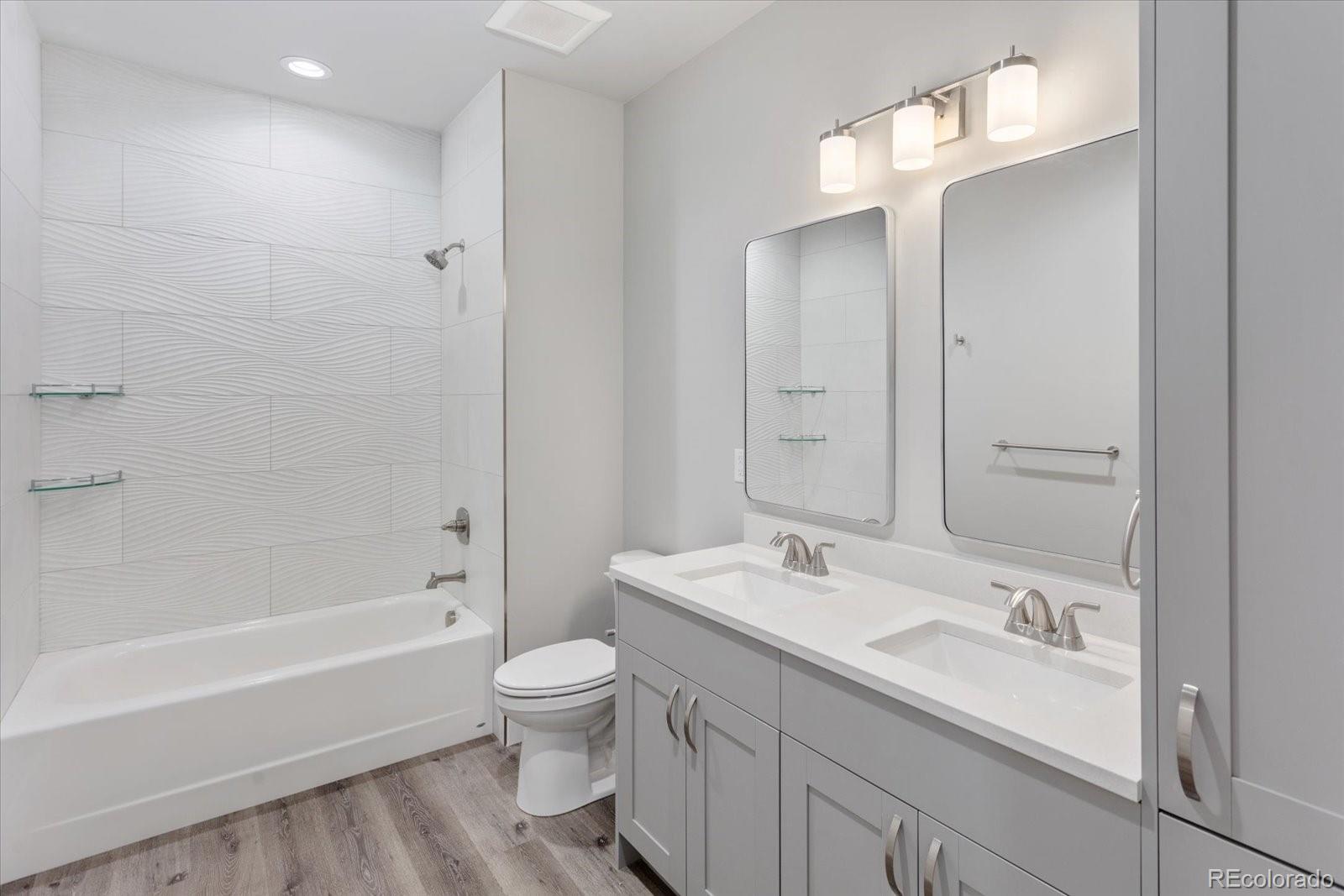 128 Southside Loop Salida, CO 81201 - Photo 15 of 20 a bathroom with a bathtub shower sink vanity and toilet