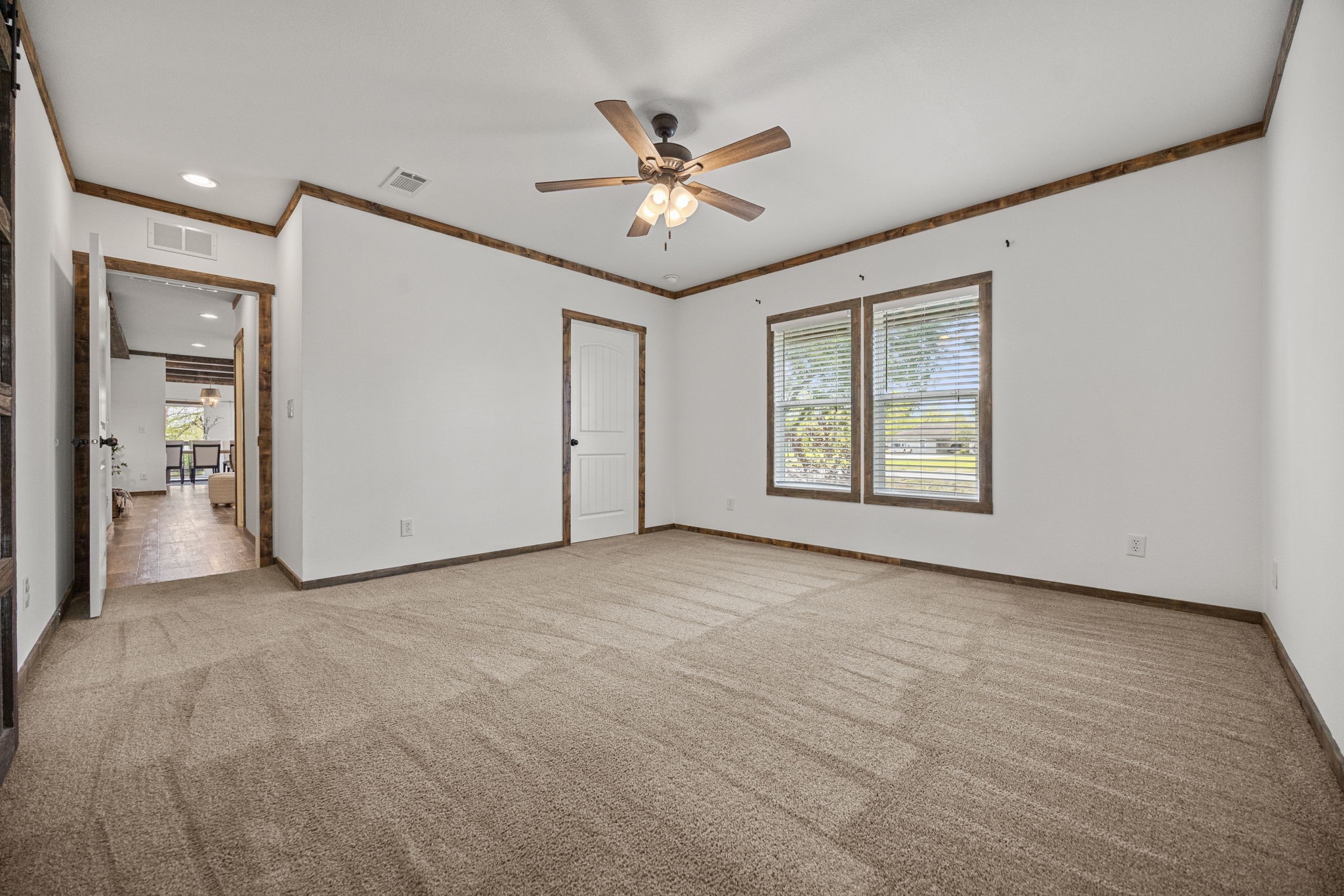 12708 28th Street Santa Fe, TX 77510 - Photo 17 of 29 an empty room with ceiling fan and windows