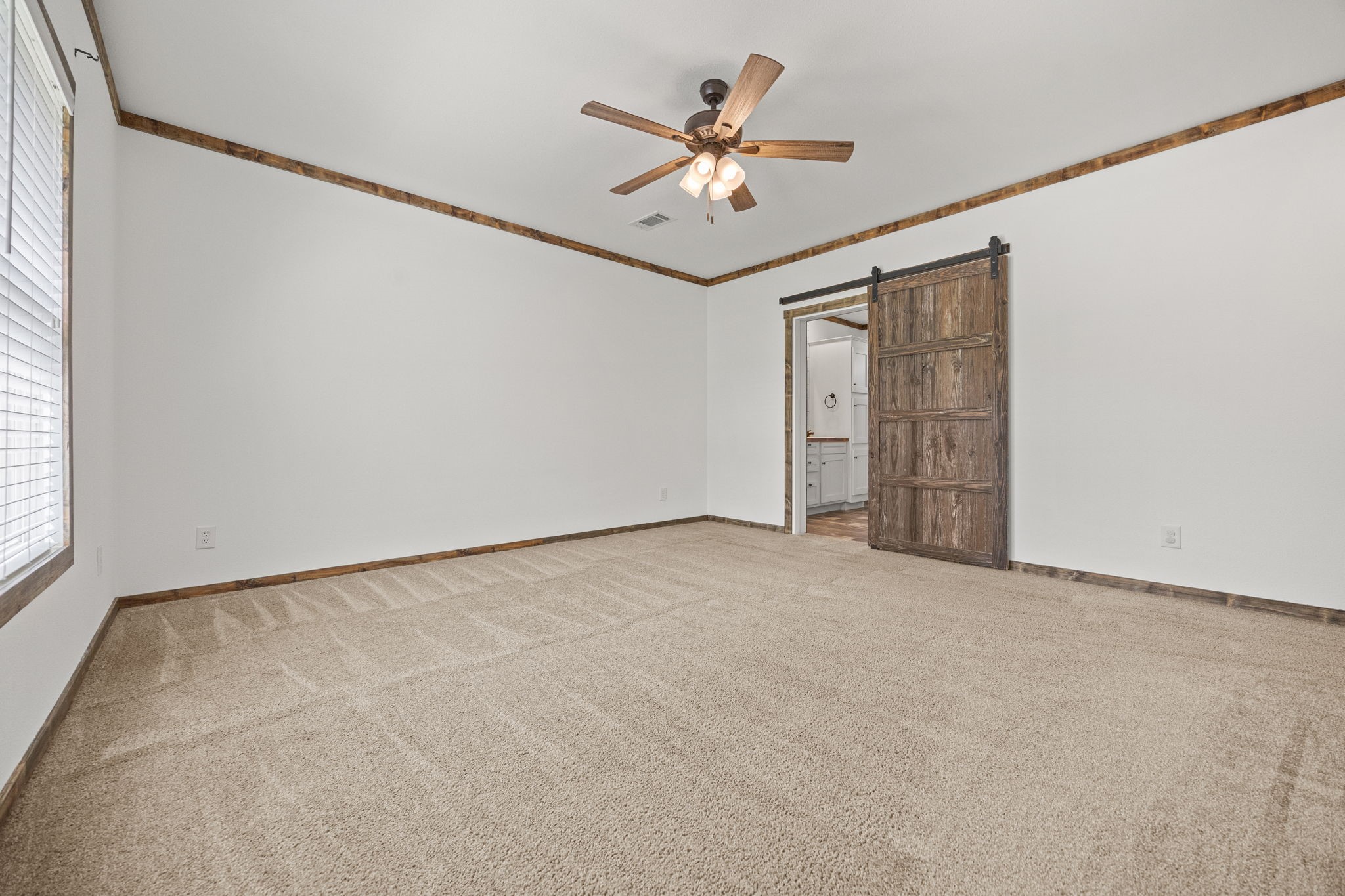 12708 28th Street Santa Fe, TX 77510 - Photo 18 of 29 an empty room with windows and fan