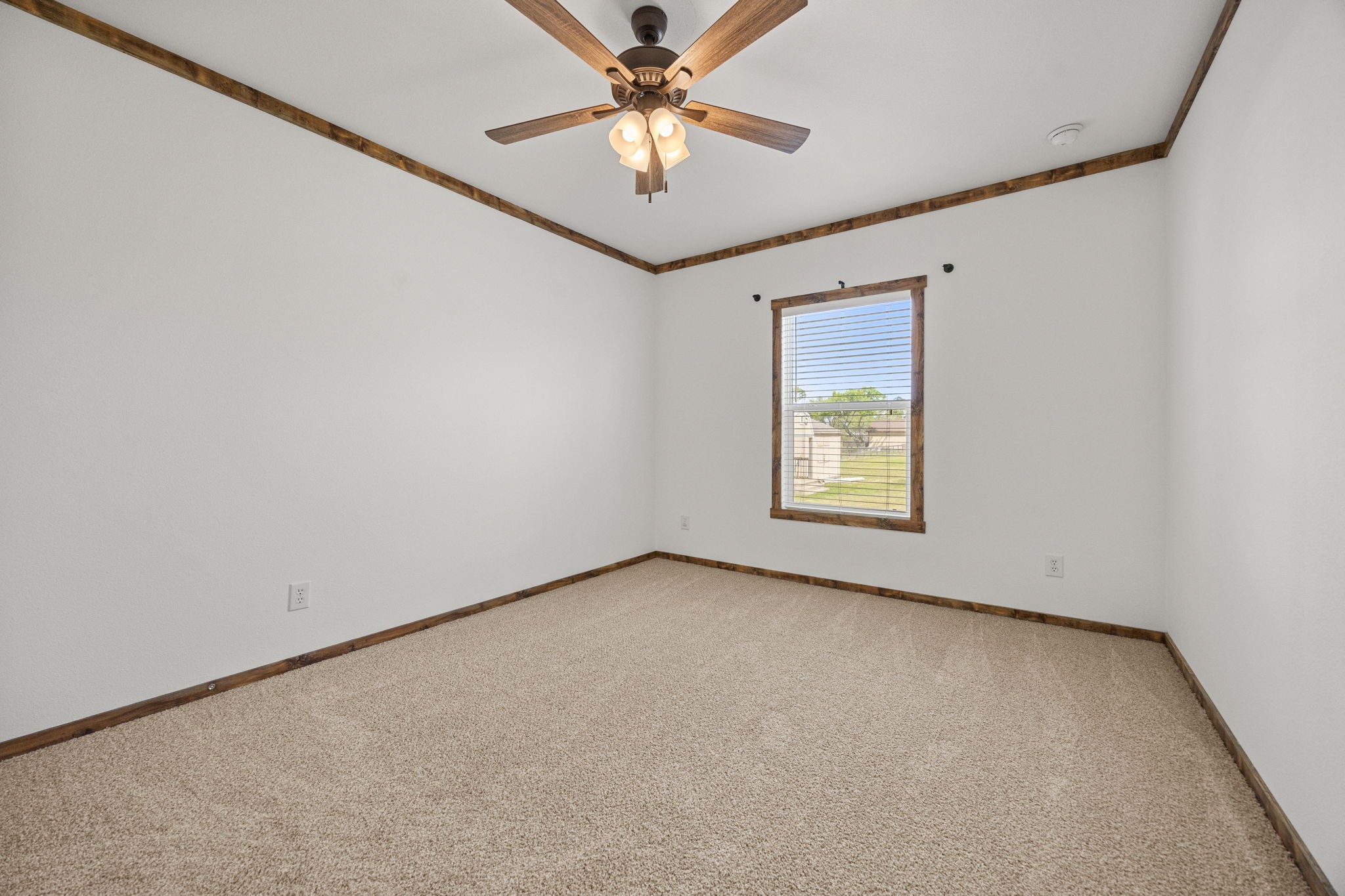 12708 28th Street Santa Fe, TX 77510 - Photo 22 of 29 an empty room with windows and fan