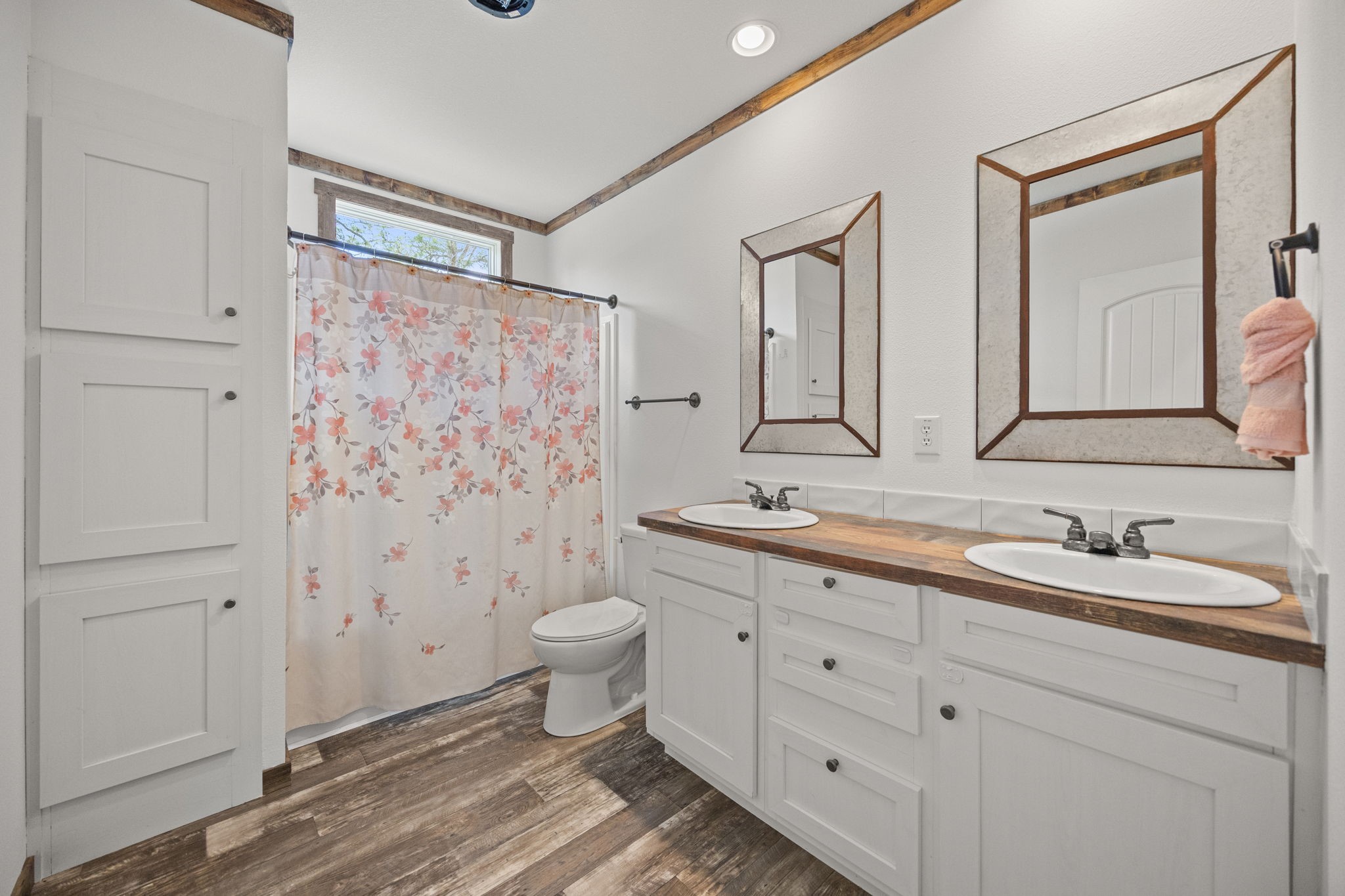 12708 28th Street Santa Fe, TX 77510 - Photo 24 of 29 a bathroom with a granite countertop sink toilet a mirror and shower