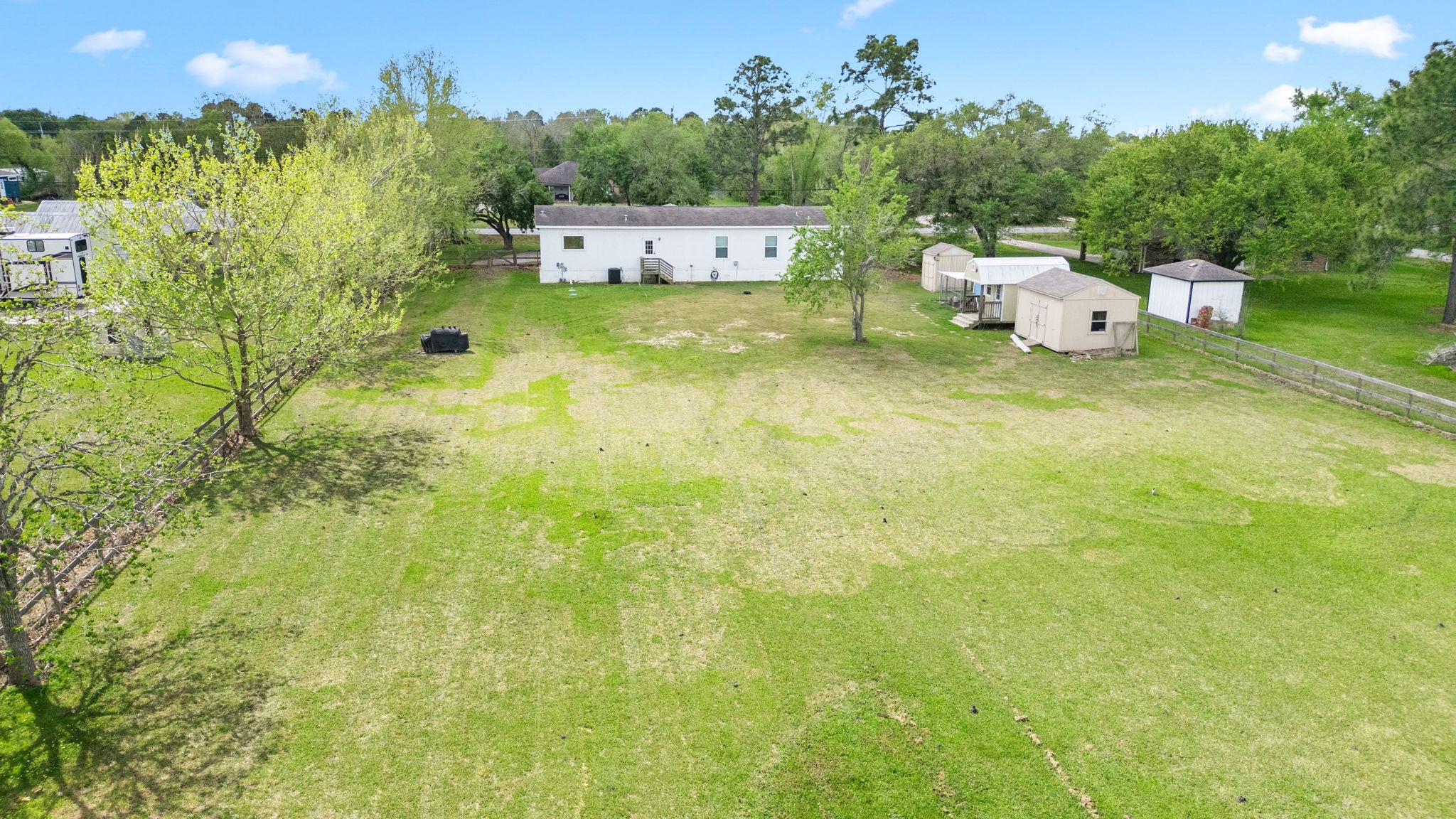 12708 28th Street Santa Fe, TX 77510 - Photo 27 of 29 a backyard of a house with table and chairs