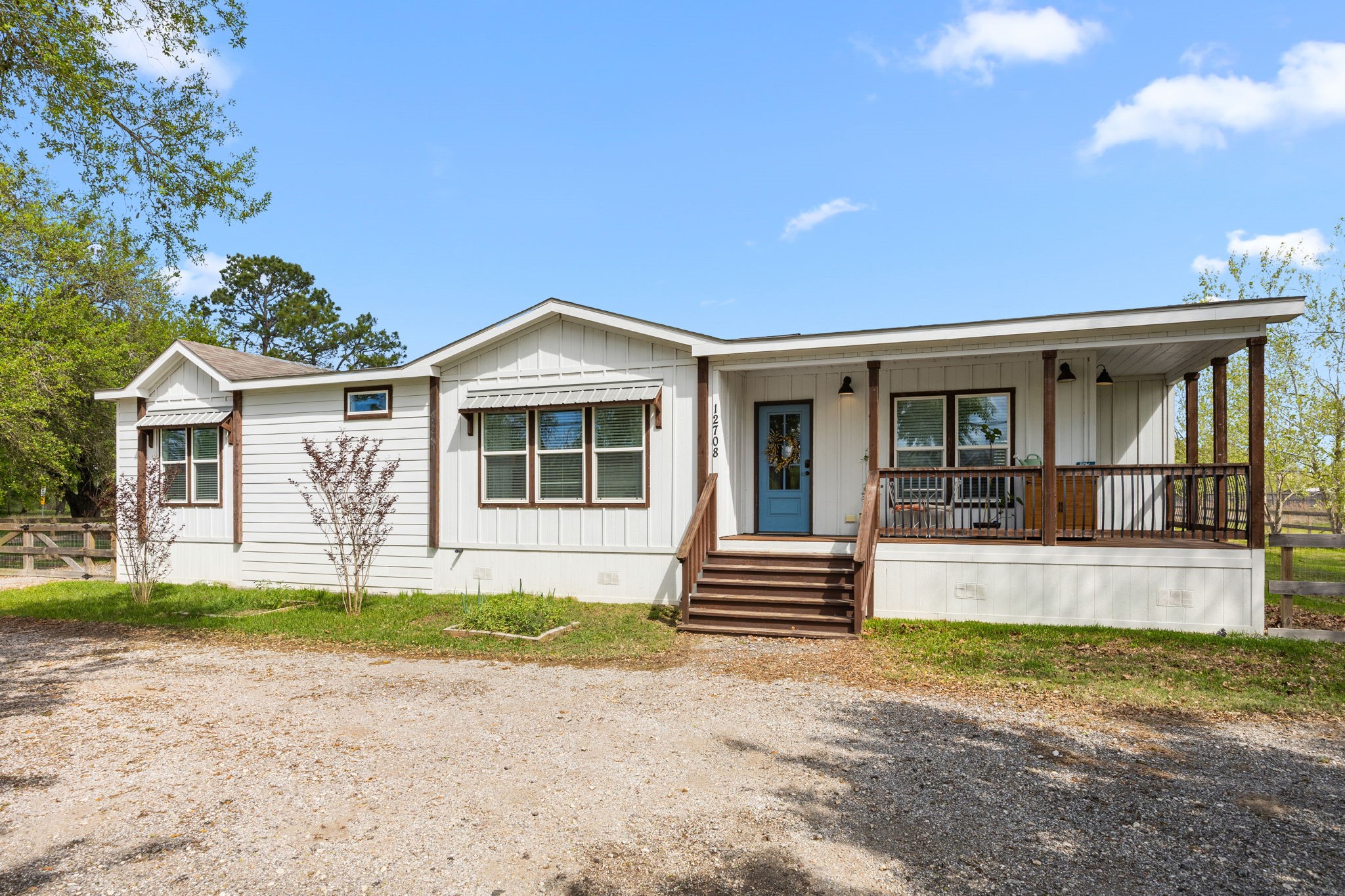 12708 28th Street Santa Fe, TX 77510 - Photo 3 of 29 a front view of a house with a garden and yard