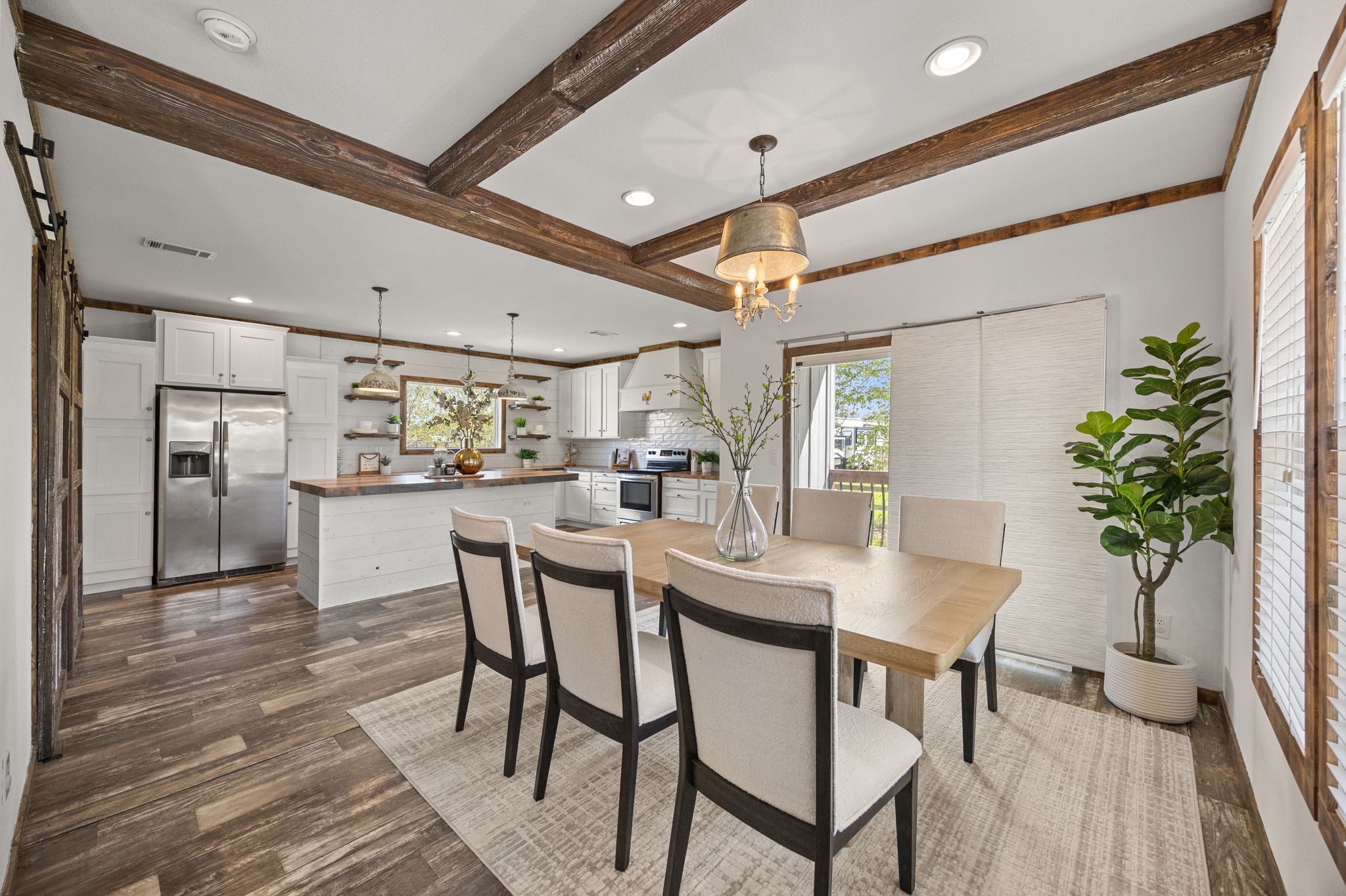 12708 28th Street Santa Fe, TX 77510 - Photo 7 of 29 a view of a dining room with furniture and wooden floor