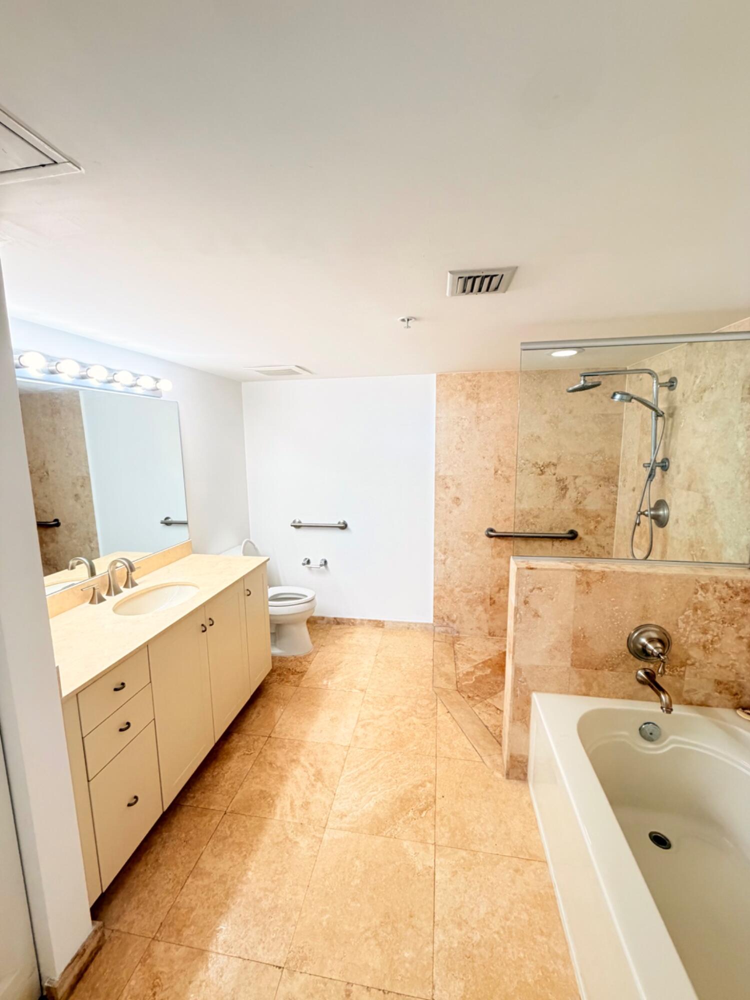 3232 Coral Way, Unit 1601 Miami, FL 33145 - Photo 11 of 27 a bathroom with a tub sink and mirror