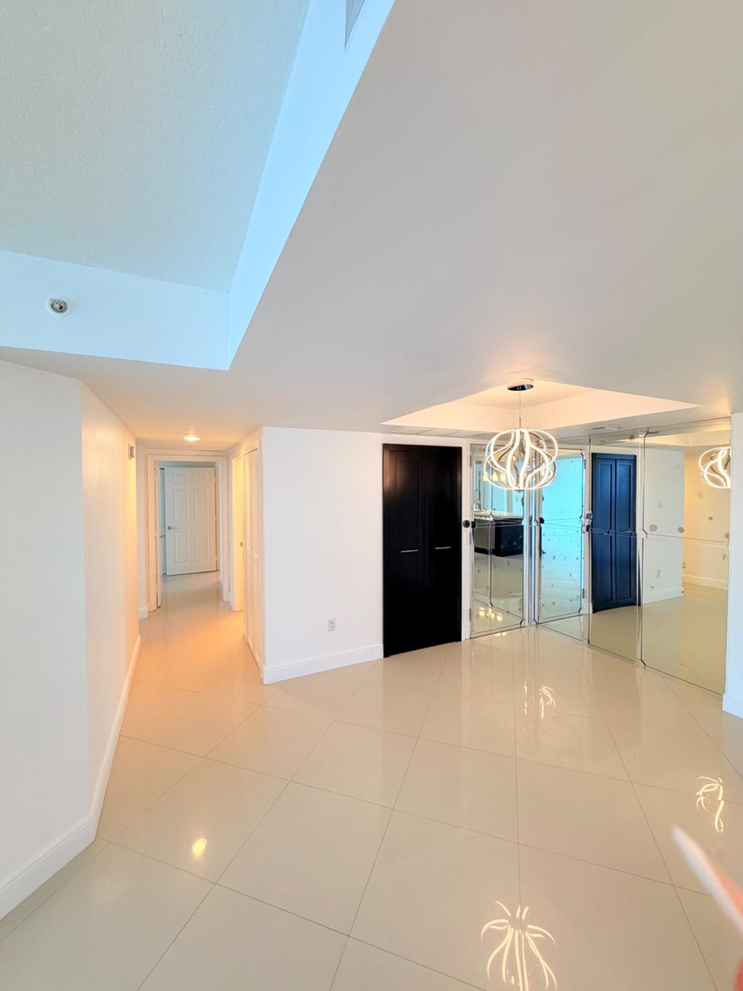 3232 Coral Way, Unit 1601 Miami, FL 33145 - Photo 14 of 27 a view of an empty room with a kitchen