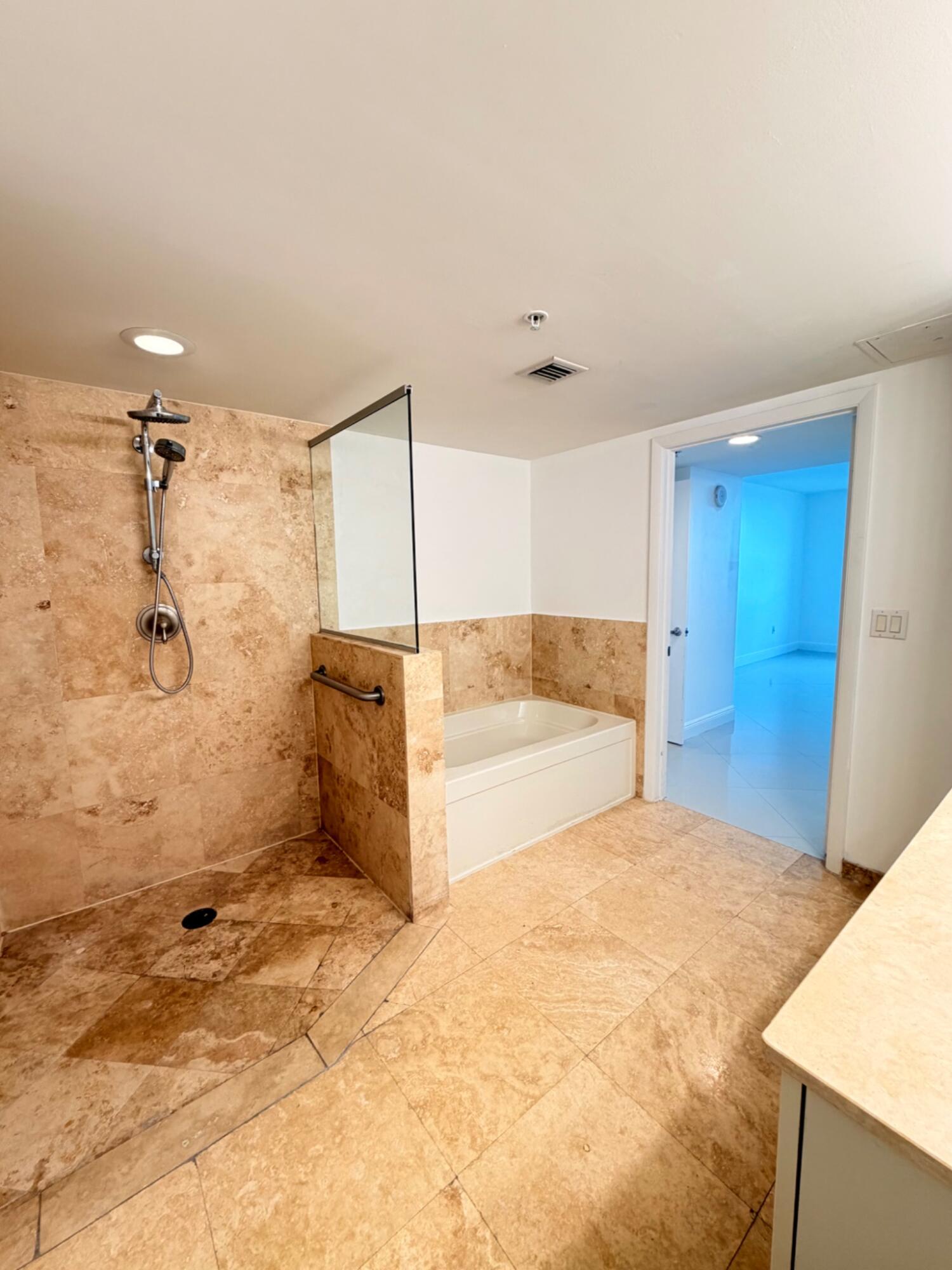 3232 Coral Way, Unit 1601 Miami, FL 33145 - Photo 22 of 27 a view of a bathroom with a shower and a sink
