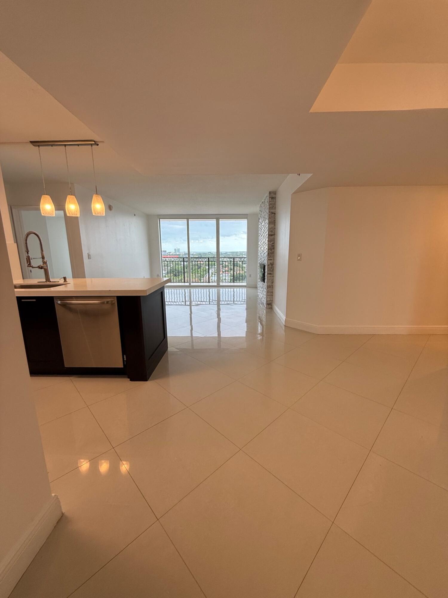 3232 Coral Way, Unit 1601 Miami, FL 33145 - Photo 4 of 27 a view of kitchen and empty room with fireplace