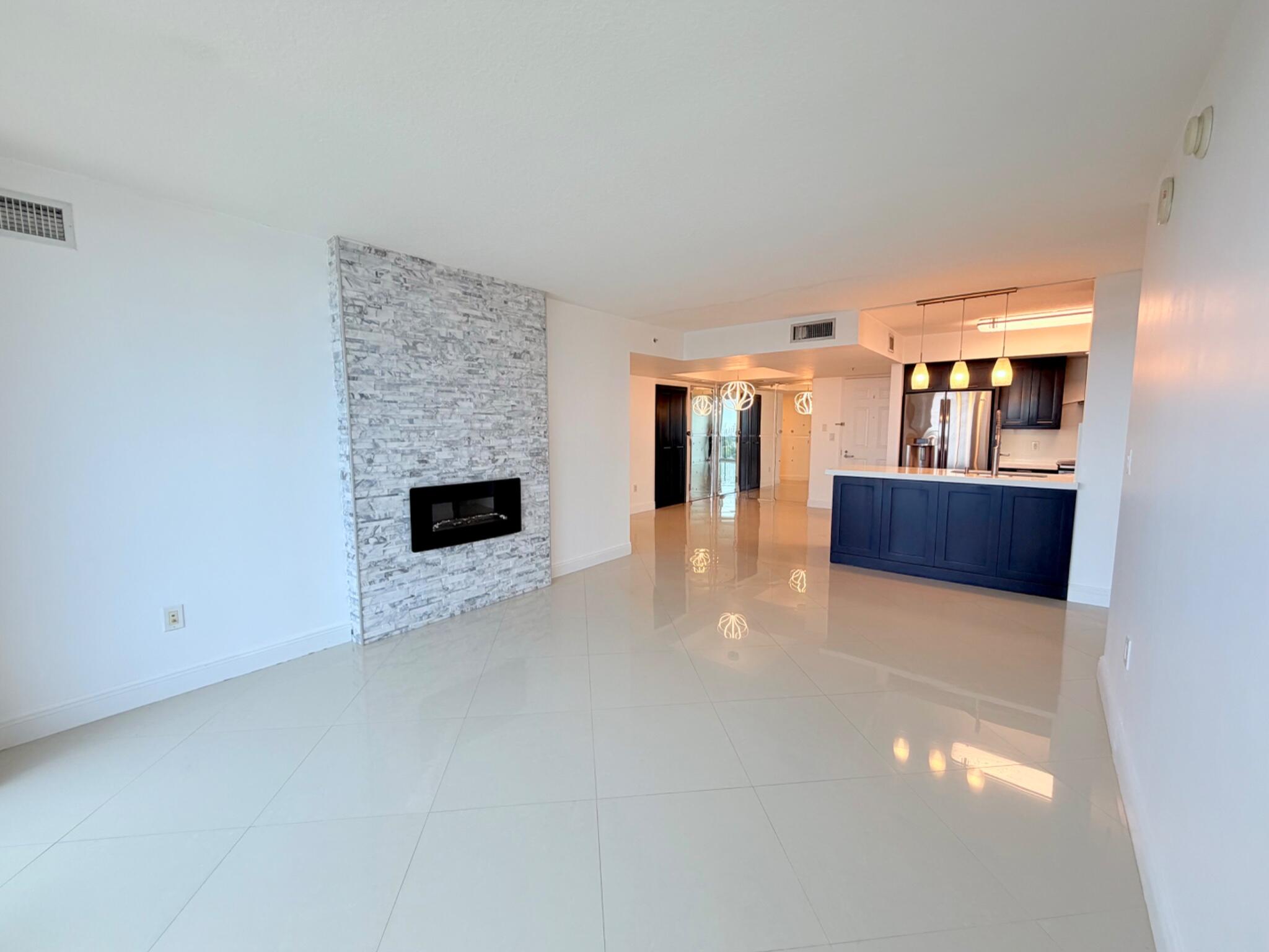 3232 Coral Way, Unit 1601 Miami, FL 33145 - Photo 8 of 27 a view of a livingroom with furniture and fireplace