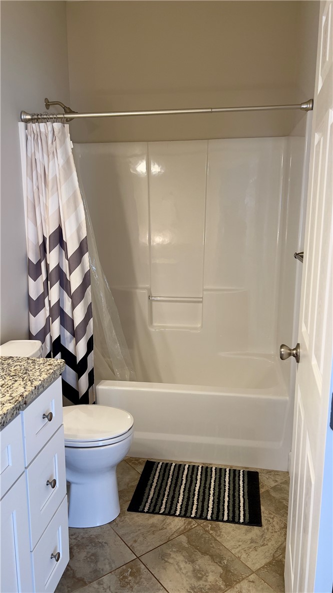 160 Hudgins Lake Road Townville, SC 29689 - Photo 14 of 41 Functional full bathroom featuring a tub and shower combination with granite countertops and tiled flooring.