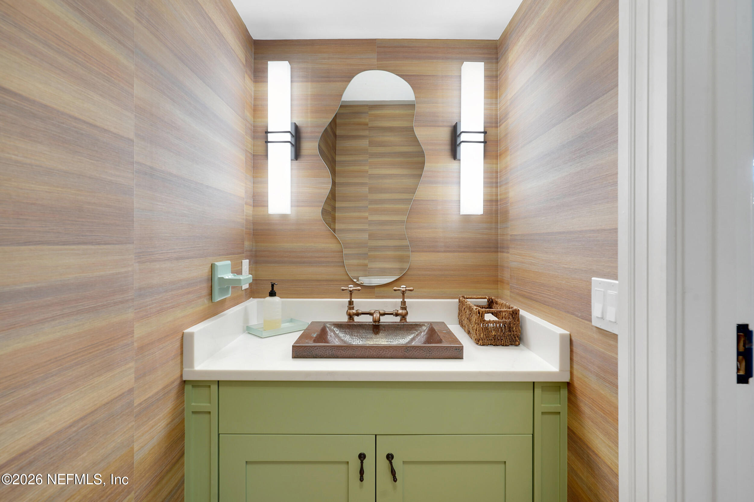 290 St George Street, Unit A St. Augustine, FL 32084 - Photo 17 of 32 a bathroom with a sink and a mirror