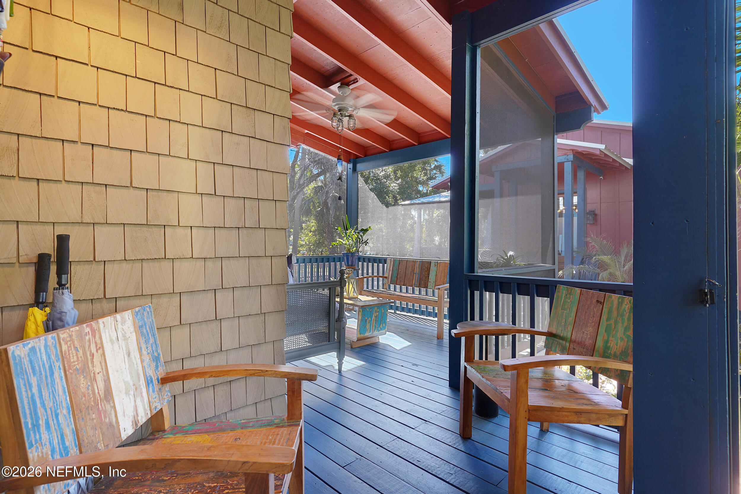 290 St George Street, Unit A St. Augustine, FL 32084 - Photo 32 of 32 a view of a porch with wooden floor and outdoor seating