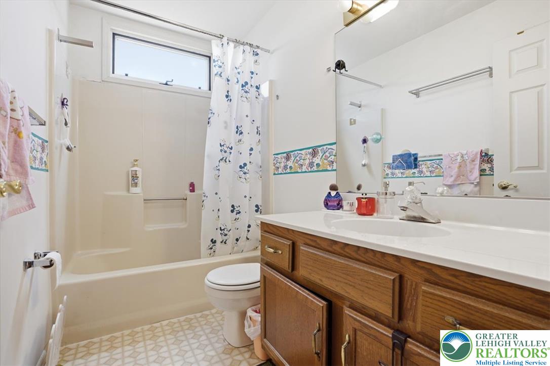808 Hunter Road Easton, PA 18040 - Photo 25 of 41 Main Bath. A well-maintained bathroom with a spacious vanity, large mirror, and tiled floors.