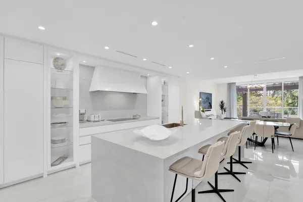 a kitchen with a table and chairs in it