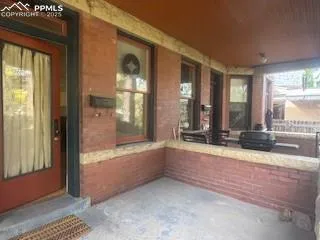 a backyard of a house with portable swimming pool and outdoor seating